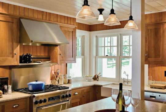 A post marks the kitchen’s original boundary. The architect pushed out the wall 6 feet, which made room for more graceful proportions and an island.