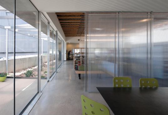 Conference room with view to entrance and studio beyond
