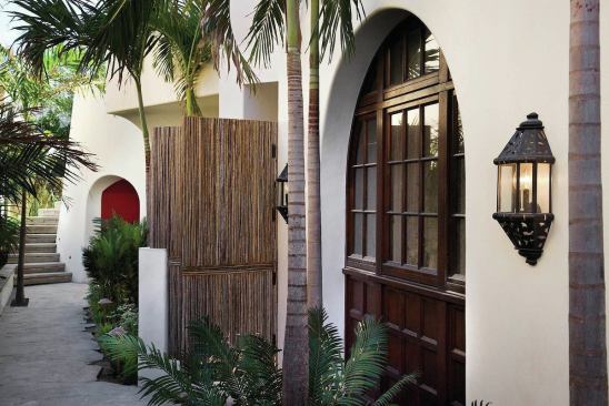 While the oceanfront side of the house is modern, the front reveals its traditional side.