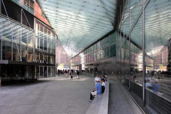 The granite bench by landscape architect Ken Smith allows people to meet and catch their breath in the arcade.