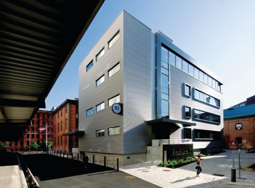 The north and east faces are clad in Morin Corp. metal panels in a nod to the building’s industrial environs.