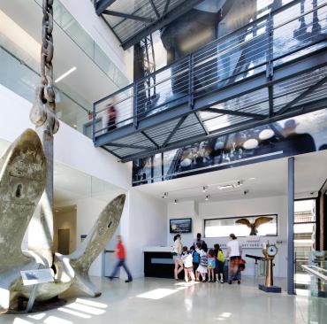 Connecting the exhibition space in the historic building to the services and leasable office space and other venues in the addition is a three-story volume, spanned by bridges that feature railings from FMB. The brick on the 1857 building was restored by King’s County Waterproofing Corp.