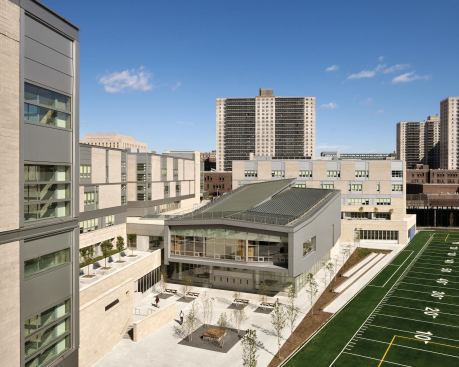 Aerial view of shared performaing arts building and adjacent sports field