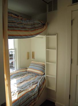 Clean proportions and well-crafted details such as built-in bookshelves make the cottage a sweet alternative to the double-wide trailer. Cusato included vertical, double-hung windows that open top and bottom for better air flow.

In addition to its appeal as temporary quarters, the Katrina Cottage can stay on site after the main house is built, either attached as a wing or used as a guest cottage. Designed to balance economy, speed, and aesthetics, the delivery method is flexible, too. It can be stick-built or prefabricated for roughly the same cost as a government-issue trailer.