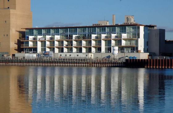 Glass curtain walls and expansive terraces at the 26-unit Riverfront Lofts overlook the Fox River in Green Bay, Wis.
