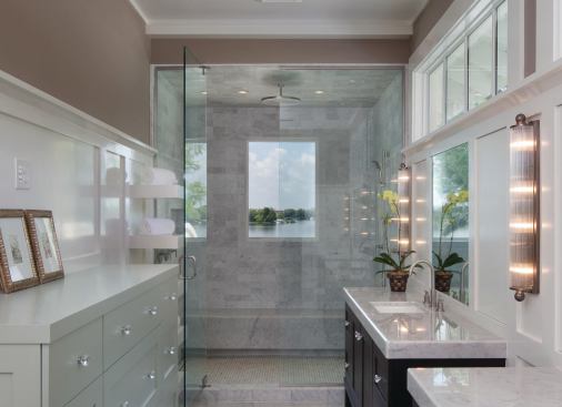 Even the master bath offers a view of the lake through the shower.