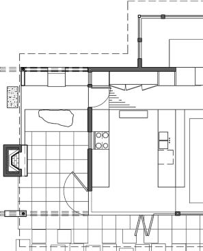 Raising the pantry and refrigerator up a step from the main kitchen serves two purposes: it keeps snack-hunters out of work zones and it places ingredients within easy reach of the outdoor cooking center.