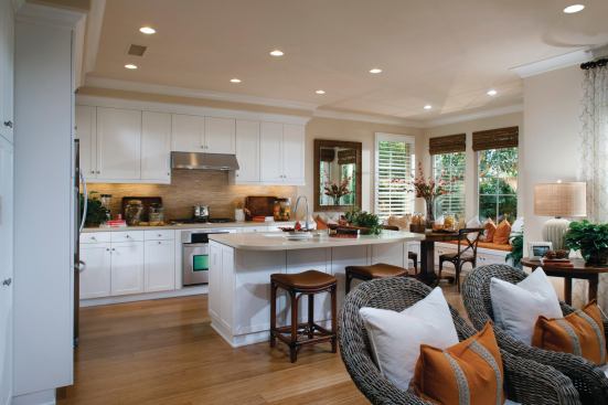 A classic white kitchen is integrated into the great room space.