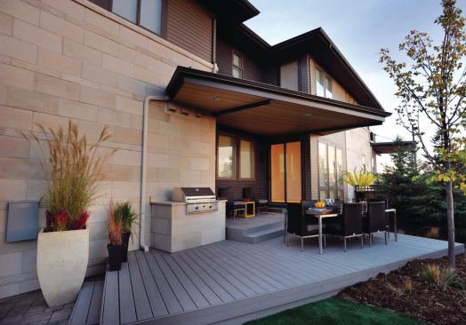 An outdoor space was squeezed into the side of the home that sits on a narrow, alley-loaded lot.