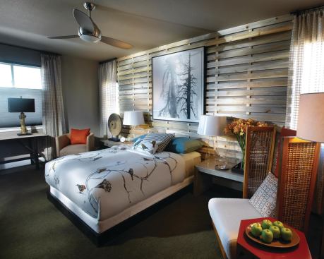 The upstairs master suite is the full width of the narrow home.

