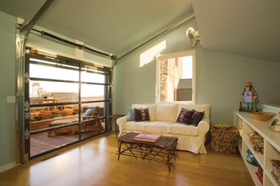 Residential Architect November-December 2011  New Heights  Architect: Albertsson Hansen Architecture, Minneapolis General Contractor: Choice Wood Co., St. Louis Park, Minn.   The sunroom’s glazed overhead door opens onto a private rooftop deck.