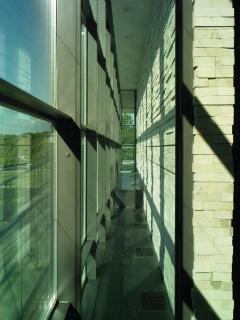 Setback between electrochromatic glazing and trombe wall.