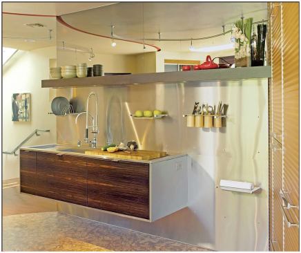 What you don’t see in this cosmopolitan kitchen are details ranging from the conscientious to the sublime: a built-in composter beneath the custom cutting board (above) neatly eliminates waste and a mirror above the cantilevered sink (right) becomes a giant TV screen with the flick of a switch.