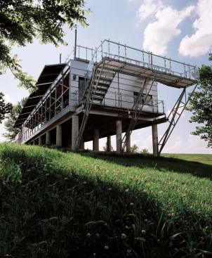 Rooted in the function of the elevated shed, the Platform House nods to the vernacular tradition of raising buildings off the ground to eliminate moisture. Inside, simple partitions allow for a clear organization of space (top). Outside, the articulation of the skin recalls corncribs that dot the landscape (above).