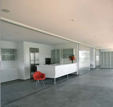 Rooted in the function of the elevated shed, the Platform House nods to the vernacular tradition of raising buildings off the ground to eliminate moisture. Inside, simple partitions allow for a clear organization of space (top). Outside, the articulation of the skin recalls corncribs that dot the landscape (above).