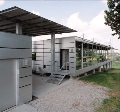 Rooted in the function of the elevated shed, the Platform House nods to the vernacular tradition of raising buildings off the ground to eliminate moisture. Inside, simple partitions allow for a clear organization of space (top). Outside, the articulation of the skin recalls corncribs that dot the landscape (above).