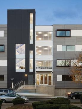 The Modules stacks 72 prefabricated stick-framed apartment units atop a concrete and steel plinth.