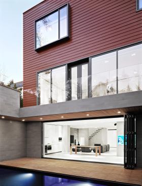 The Bayside Residence features open interiors and warm wood.