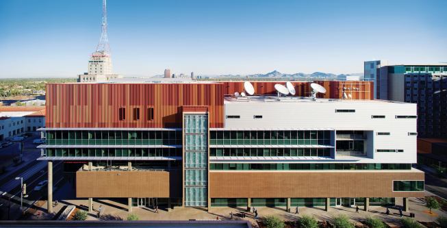 Expressing the satellite dishes--normally hidden away--was a conscious choice on the part of the design team. The rest of the building's south façade is broken up by differences in material and form that denote the spaces within, creating a more subtle transparency of expression. ROOFING - Sarnafil Single-ply membrane roof - sarnafil.com - SUNSHADES - KT-Fabrication - Aluminum horizontal sunshading system - ktfab.com