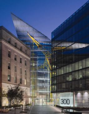 A decisive architectural gesture, the entrance to 300 New Jersey Avenue is defined by the triangular roof form that boldly juts out over the building and is supported by a structural “tree,” which continues inside and is painted yellow. 