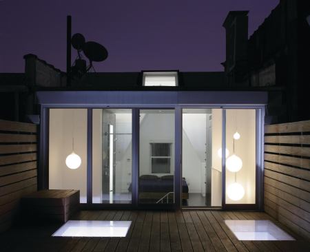 Ipe pallets, cut around skylights, create conversation space on the roof. 