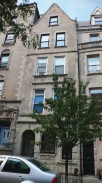 The apartment occupies the building’s top one-and-a-half stories.