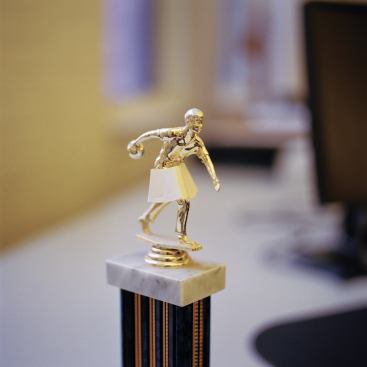 A bowling trophy in the offices of Ross Barney Architects received a feminist makeover.