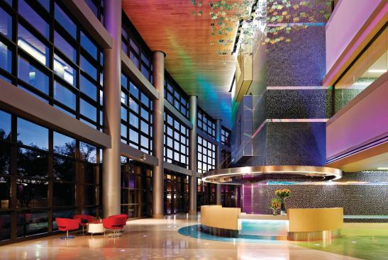 In the three-story main lobby and elevator core, patients are welcomes with shaded glass walls and LED-animated interiors.