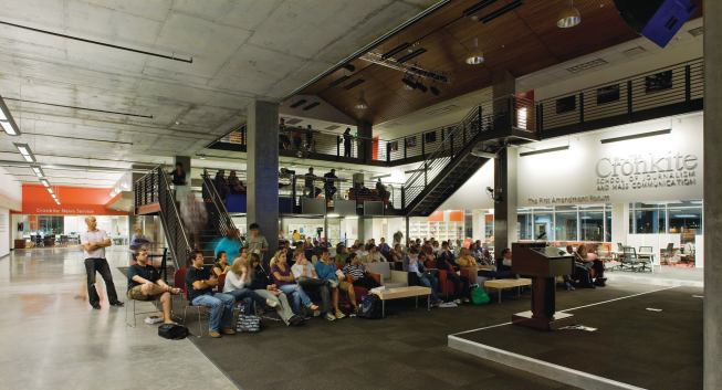 Dimmable lights and a bevy of A/V systems allow the space to be used for multimedia presentations without disturbing the activities in surrounding classrooms and media labs. A stage allows the speaker to be seen without requiring raked auditorium seating. FLOOR SYSTEM - Tate Access Floors - Raised flooring - tateaccessfloors.com - MODULAR CARPET TILES - Shaw Contract - Asphalt - shawcontractgroup.com - PAINT - Sherwin-Williams - Interior paint - sherwin-williams.com