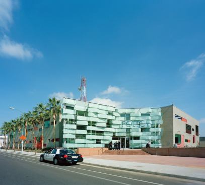 Large windows and bright colors dot the exterior of the building in contrast to the impermeable exterior of the old station. In front of the glass façade, a community plaza provides a space for local events and for the officers to interact with area residents.