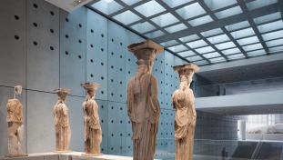 The caryatids look across Tschumi’s central atrium to pediment sculptures from the Parthenon.