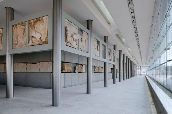 The Parthenon frieze remnants, metopes, and pediment sculptures occupy the light-filled top floor gallery.