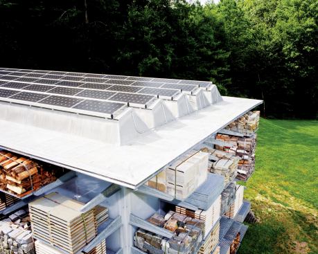 Translucent photovoltaic panels are integrated into skylights on the building's roof. The system produces more than enough energy to power the building, allowing the client to recoup principal costs for the system more quickly by selling the excess electricity back to the local utility company.
