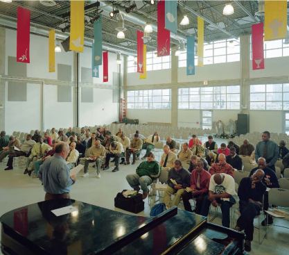 Residents can gather in several public spaces to listen to a presentation in the mission's main meeting space (far bottom left) or in the main cafeteria (bottom middle), which can seat 600 and serves 1,800 meals three times a day. Quiet reflection is allowed in the chapel (bottom, near left), which is also used for regular religious services.