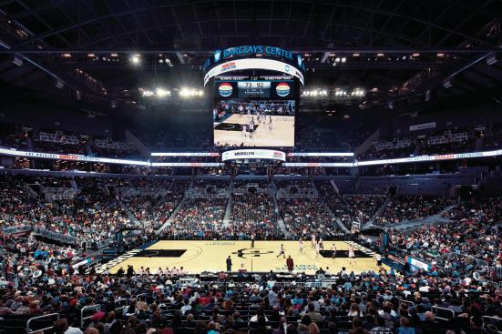 With black seats, walls, floors, and ceiling, the main bowl of the arena is a multifunctional space (here hosting an exhibition game for the Harlem Globetrotters) that can seat nearly 18,000 for a Brooklyn Nets game and 19,000 for a concert.