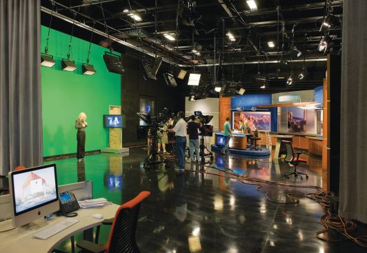 Television studios in the building, complete with professional camera and sound equipment and a green screen for weather reports and other computer graphics, allow broadcast journalism students to hone their skills. The building also houses a studio for the local PBS affiliate. CAMERA SUPPORTS - Vinten - Osprey - Elite camera support - vinten.com - TASK CHAIR - Steelcase - Leap - steelcase.com - FLOORING - Staticworx - ESD vinyl floor tile - staticworx.com