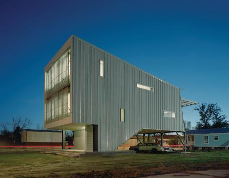The elevated Porchdog House, which Blackwell designed as part of Architecture for Humanity’s Biloxi Model Home program, bridges its distance from the ground with a street-level porch, storage space, and a covered parking area.