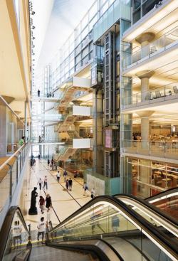 The centerpiece of the library is a 5-story atrium topped with a 60-foot-long zinc canopy, which allows an abundance of natural light into the building.