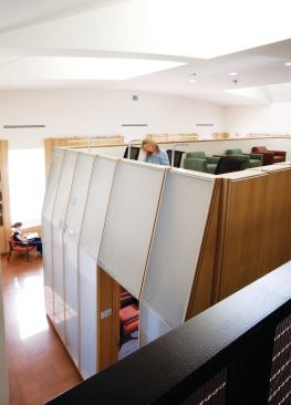 On the double-height second floor, students and faculty can meet and mix in the research space perched atop the office enclosure.