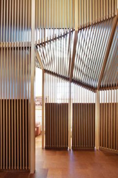 The screen is composed of 1-by-6-inch walnut veneer planks.