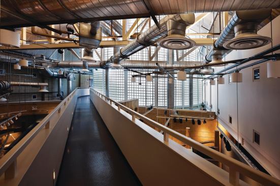 A catwalk leads from the Room of Remembrance to the Hall of Reflection, another roughly cylindrical volume in the lighter wing that offers visitors a chance to reflect on all they have seen. The catwalk is suspended above the North Gallery and sits just under a maze of exposed ductwork. The design intent was to create a building that was raw and transparent in its functions.