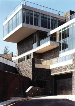 The masonry walls of the new Marriott Hall were designed to match those of the original 1909 school building as much as possible. Since the original quarry was long-closed, the team selected stone—based on a color match—from White Hall, N.Y., in the Adirondack Mountains, and they executed several mock-ups to ensure that the mortar work had the same hand-tooled raking as the original. The design team selected darker stone to act as a sort of wainscoting where the building meets the ground plane, another homage to the original building.