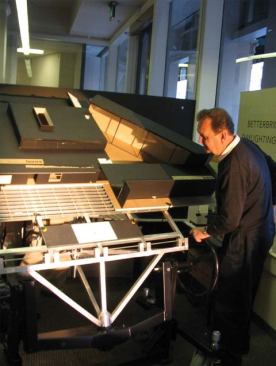In the daylighting lab, Heinz Rudolf with a model of the building on the heliodon.