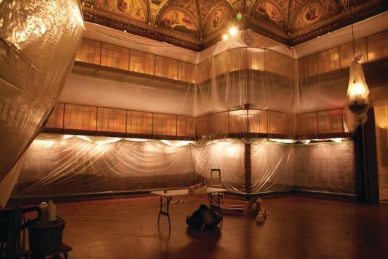 The cases were then shrouded in plastic to protect the collection as the floor, ceilings, and other surfaces were restored.