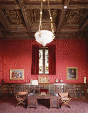 More faded red wallcoverings and furniture and finishes In the West room.