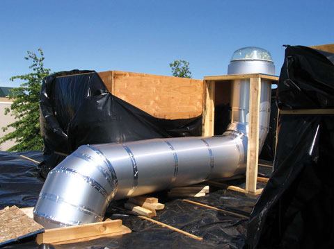 Testing lighting levels inside the classroom mock-up was essential to the design process for several reasons, primary among them, the ability to test a proposed 8-foot horizontal offset daylighting shaft, provided by Solatube, seen from the roof during mock-up construction.