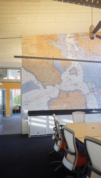 A two-story lobby in the center of the building provides a view corridor from land to sea and allows maximum light into upstairs office spaces.