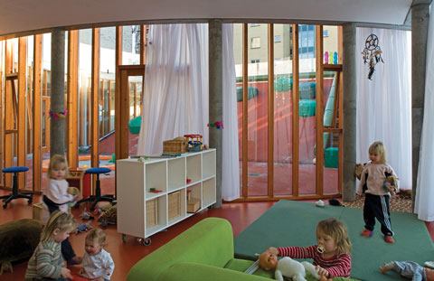 Children at play in a communal area that faces the outdoor ramp leading to the rooftop.