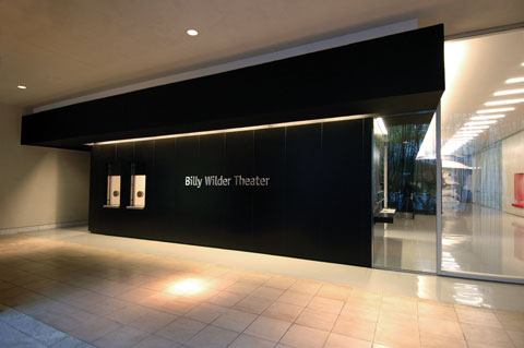 A fluorescent cove defines the top edge of the lobby box office.
