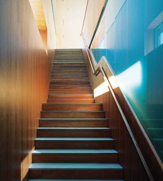 A staircase leads to the largely male domain of the second floor, with its grill, bar, and changing rooms.